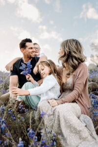 family among the purple lupine in granite bay